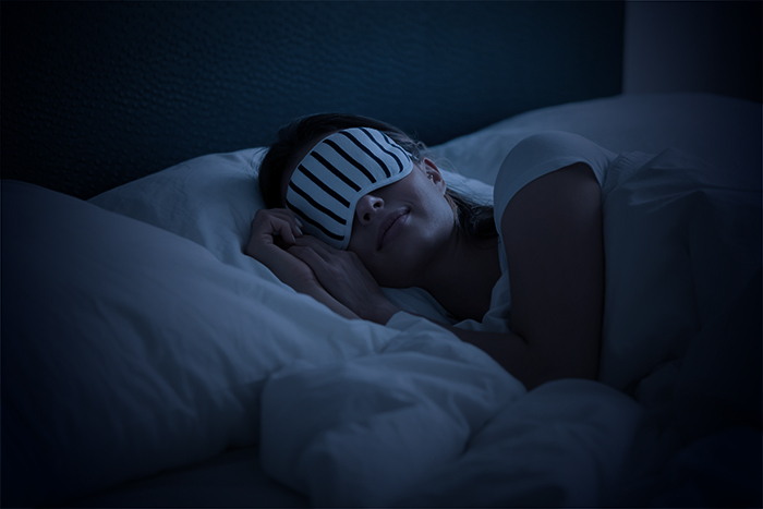 woman sleeping in hotel bed